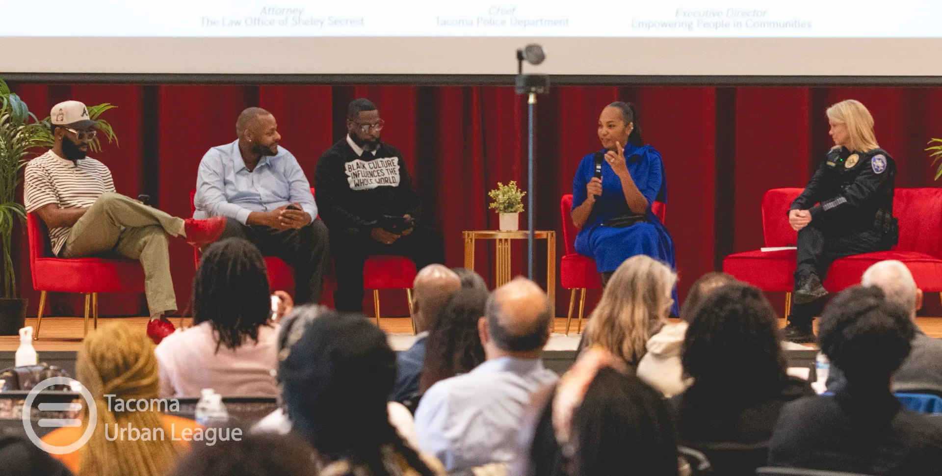 Panelists speak to a Tacoma Urban League audience during a community discussion