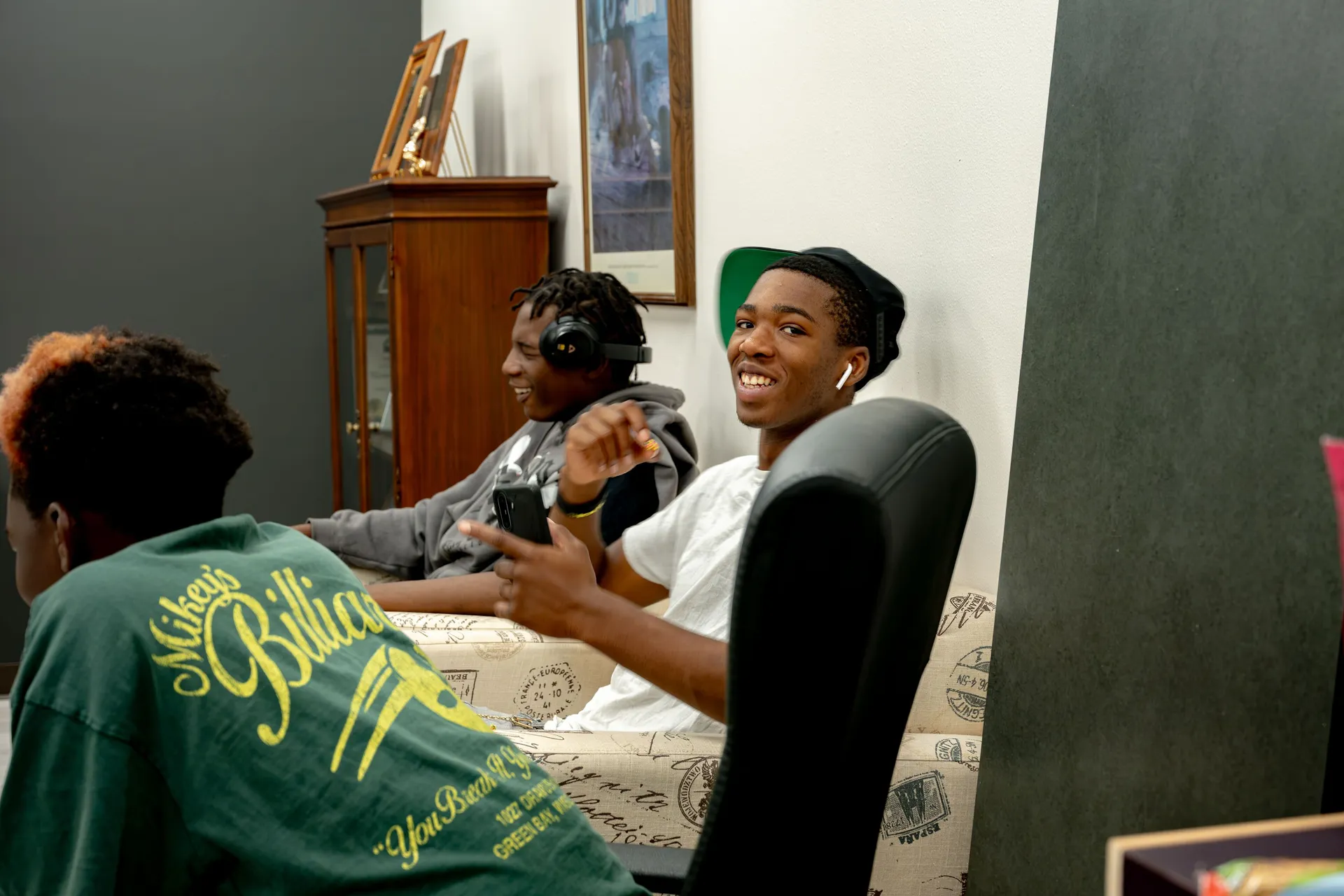 Three young creatives collaborate in a Tacoma Urban League studio